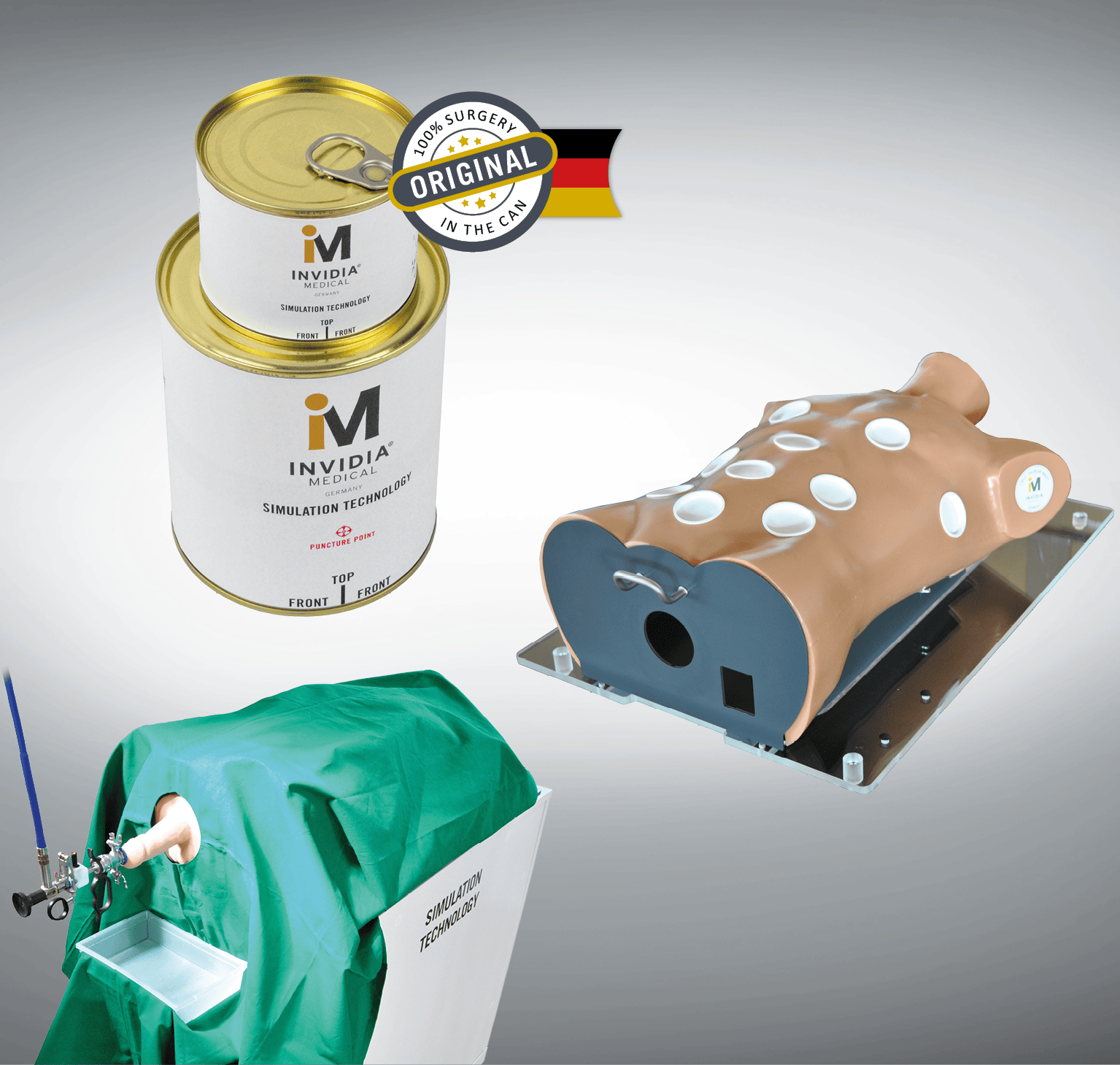 Medizinisches Simulationsgerät mit grüner Abdeckung, beige Mannequin und zwei Dosen im Hintergrund.